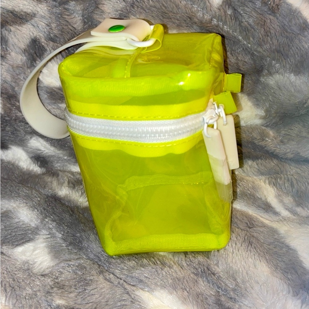 Vibrant Lime Green Cosmetic Bag with Flip-Top Lid and White Strap